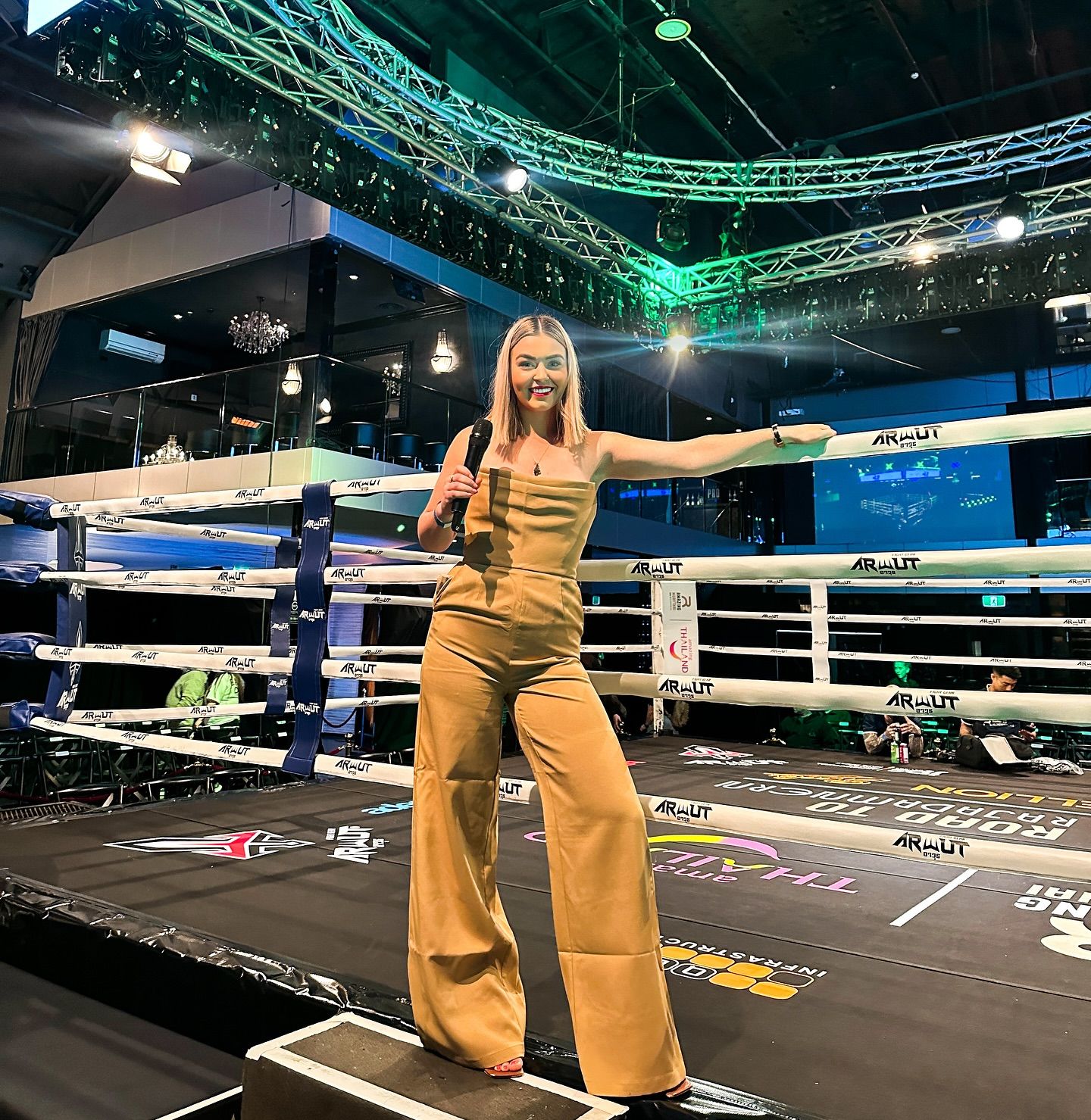 Teri announcing in the ring at a Muay Thai fight night