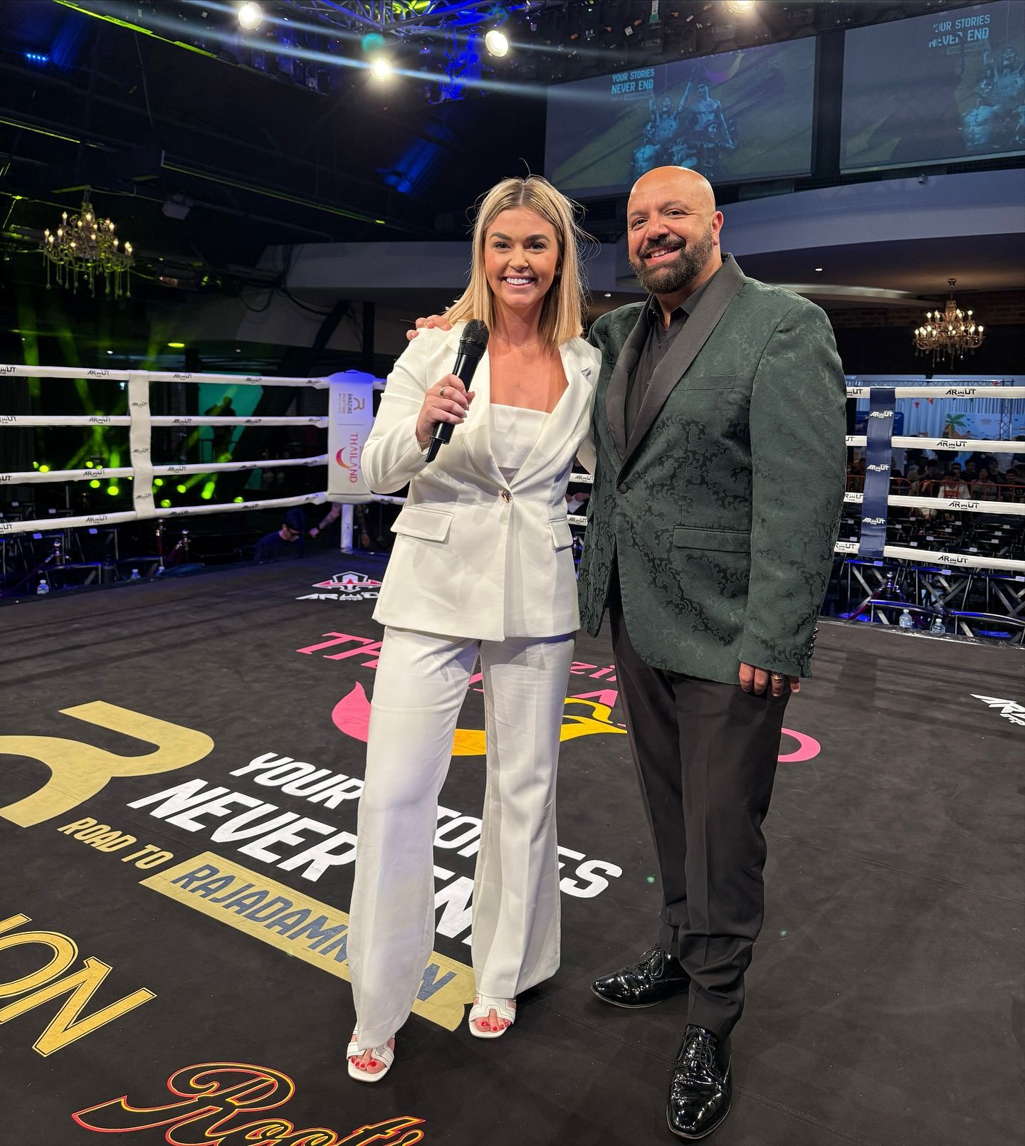 Teri in the ring with the event promoter at a fight night